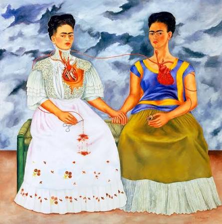 A painting depicting two women seated together, each with a visible heart connected by a red thread. The woman on the left wears a white dress with a corset, while the woman on the right is dressed in a blue top and green skirt. The background features swirling gray clouds, adding an emotional intensity to the scene.